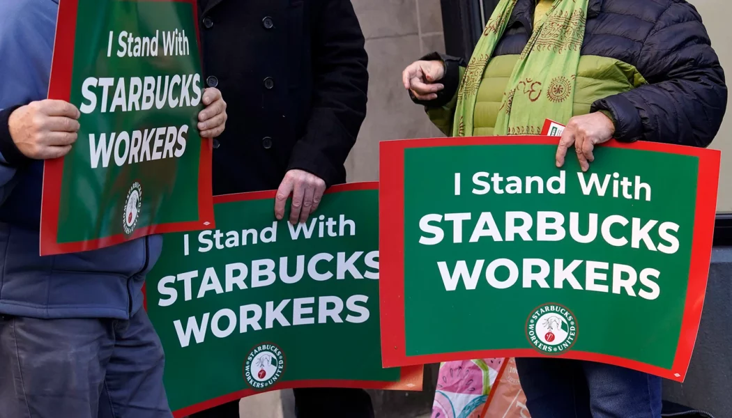 Employees on strike at Starbucks walk out during the busy 'Red Cup Day' event