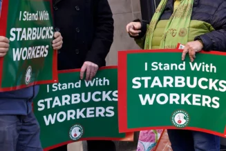 Employees on strike at Starbucks walk out during the busy 'Red Cup Day' event